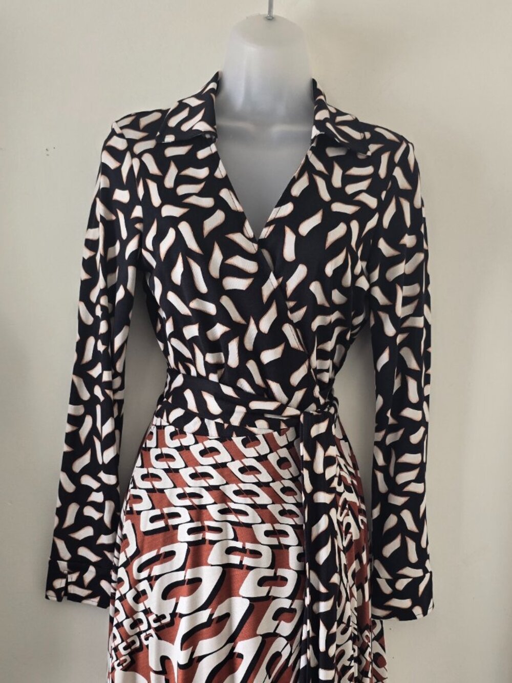 Classic "Diane von Furstenberg" black wrap dress with white/brown/rust patterns